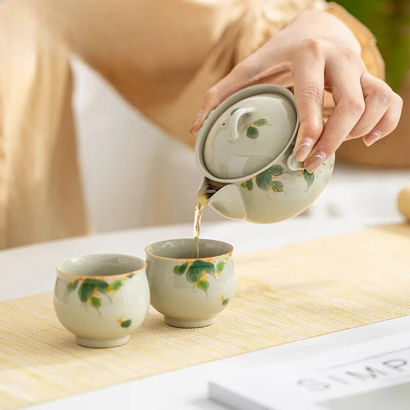 Hand-painted and Osmanthus Kung Fu Tea Set — one pot, two cups, and a travel storage bag.