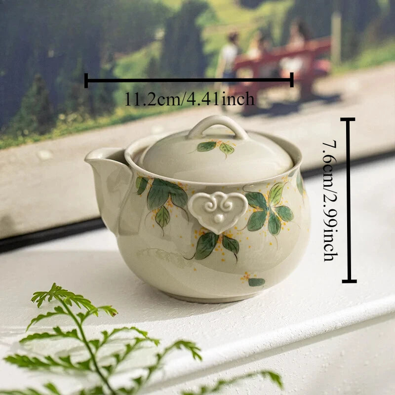 Hand-painted and Osmanthus Kung Fu Tea Set — one pot, two cups, and a travel storage bag.