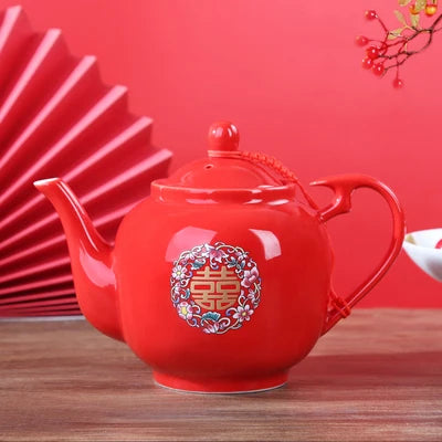 Red ceramic teapot set features the iconic Double Happiness symbol — a timeless emblem of love, unity, and celebration.