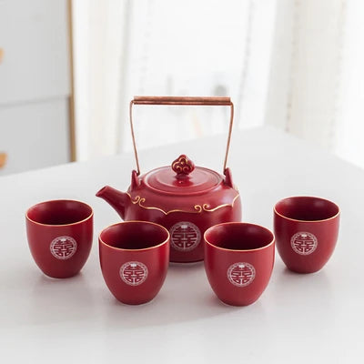 classic Double Happiness teapot paired with matching cups — vibrant red, beautifully detailed, and perfect for weddings, home décor, or thoughtful gifting.