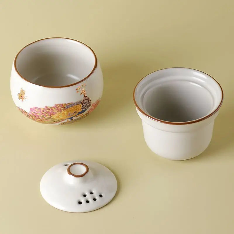 Peacock Tea Set — a one‑person travel tea ware kit with a portable ceramic pot and small cup.