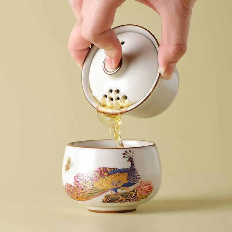 Peacock Tea Set — a one‑person travel tea ware kit with a portable ceramic pot and small cup.