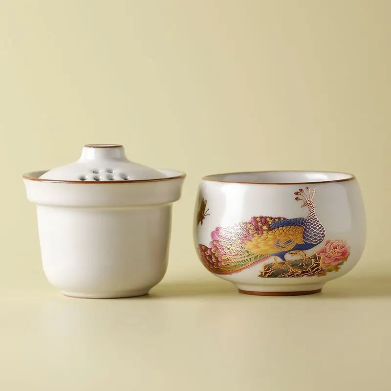 Peacock Tea Set — a one‑person travel tea ware kit with a portable ceramic pot and small cup.