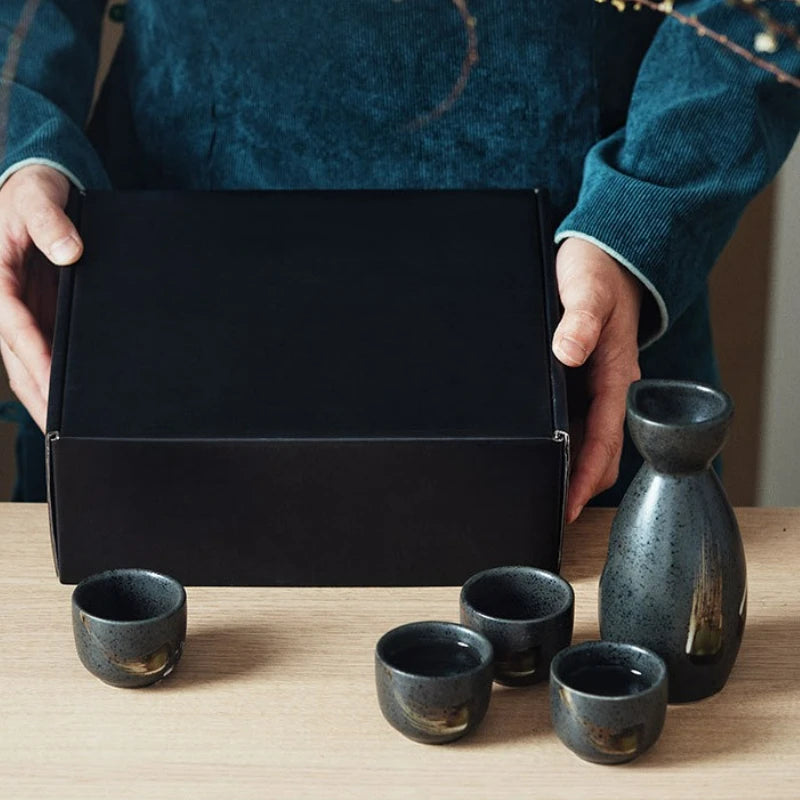 Japanese‑style ceramic sake pot and cups set — a creative bar piece with a Chinese wine separator, perfect for baijiu, sake, or home entertaining