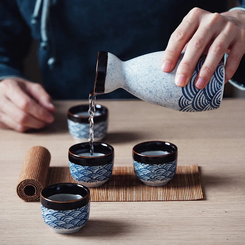 Japanese‑style ceramic sake pot and cups set — a creative bar piece with a Chinese wine separator, perfect for baijiu, sake, or home entertaining