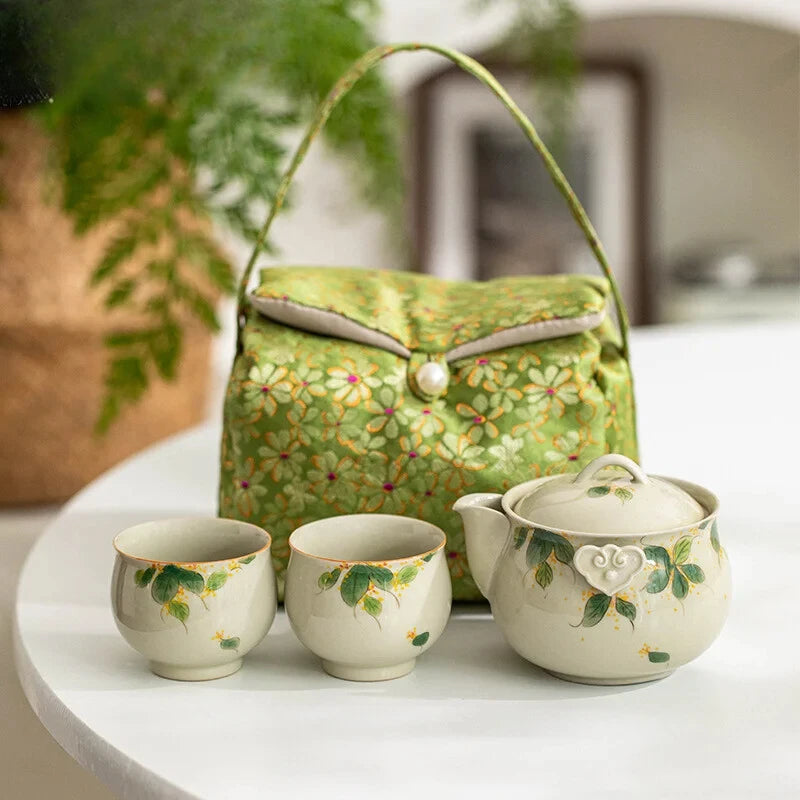 Hand-painted and Osmanthus Kung Fu Tea Set — one pot, two cups, and a travel storage bag.