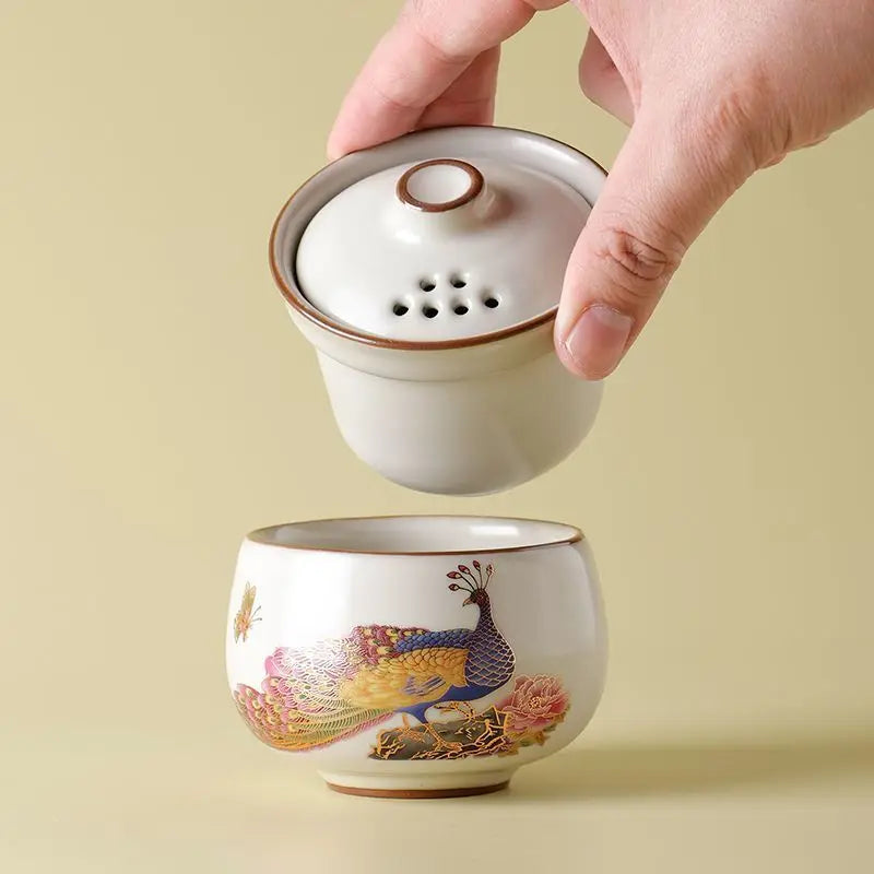 Peacock Tea Set — a one‑person travel tea ware kit with a portable ceramic pot and small cup.