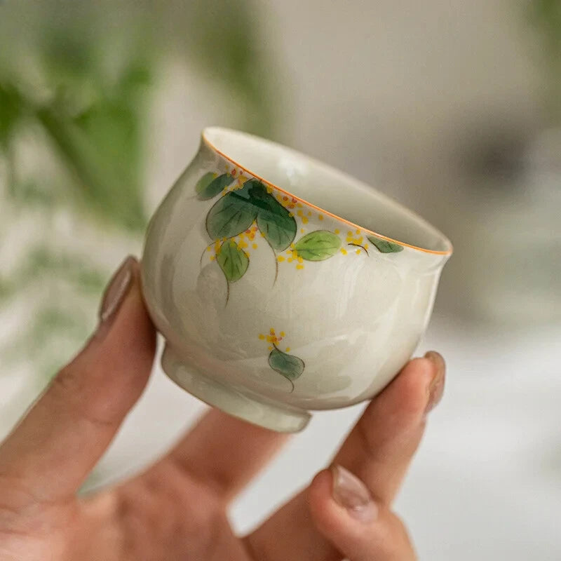 Hand-painted and Osmanthus Kung Fu Tea Set — one pot, two cups, and a travel storage bag.
