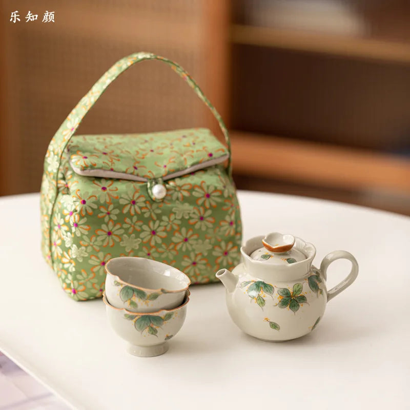 Hand-painted and Osmanthus Kung Fu Tea Set — one pot, two cups, and a travel storage bag.