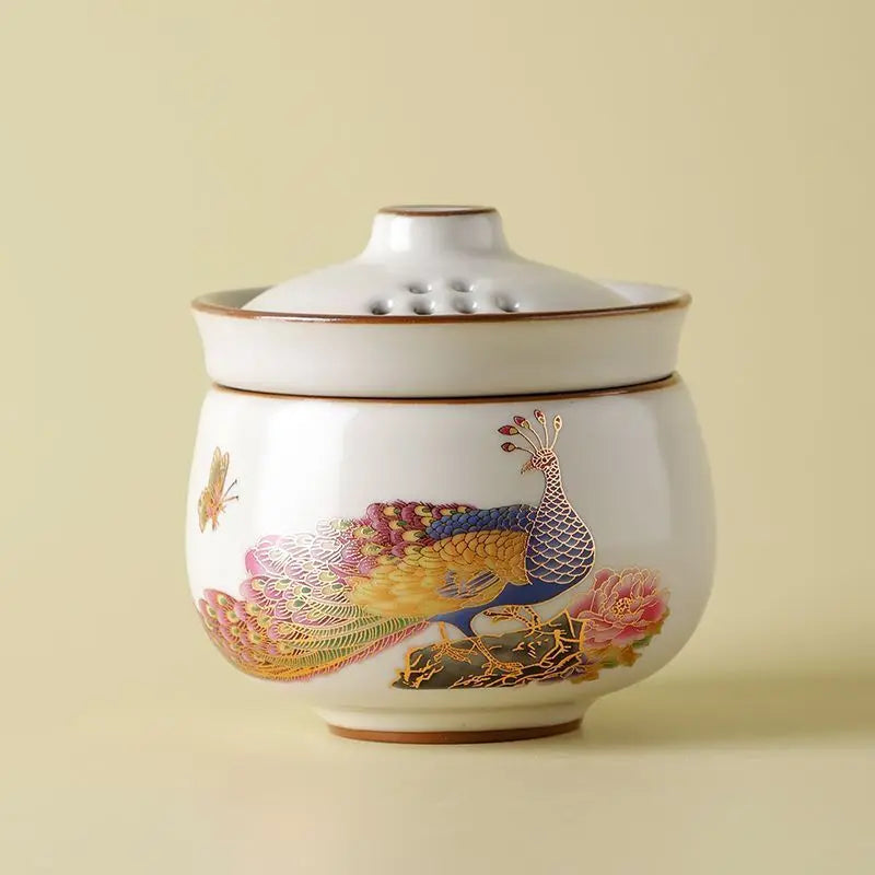 Peacock Tea Set — a one‑person travel tea ware kit with a portable ceramic pot and small cup.